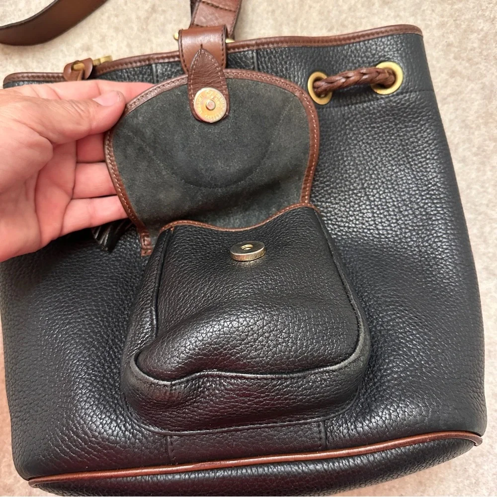 Vintage Dooney & Bourke Black w/Brown All Weather Leather Sling Small Backpack